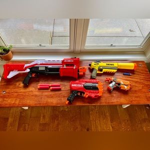 4 Nerf guns. 2 Fortnite. 2 regular. Includes 7 large bullets & 5 regular bullets